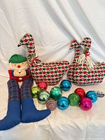 All items in lot: 12 glass ornaments, 2 fabric geese, 1 elf draft stopper