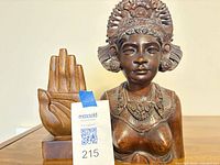 Bust of Balinese woman and hand sculpture together