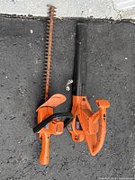 Hedge trimmer and leaf blower side by side overview