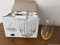 Box of six Bohemia Rainbow tumblers with one yellow-base glass displayed
