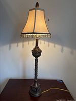Entire lamp showing shade, stem, base and cord