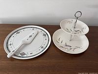 Overview of serving plate with pie server and two-tier cake stand