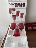 Boxed set of three stemmed red glass votive holders