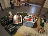 Overview of multiple bins and crates filled with Christmas decorations