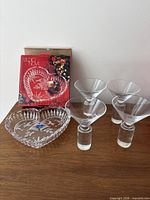 Group shot showing Studio Nova plate with box and four martini glasses