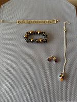 Overview of all four jewellery pieces laid out