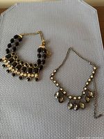 Both necklaces side by side