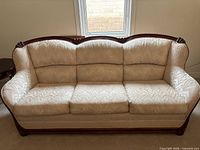 Front view of cream sofa showing full frame and upholstery