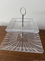 Front view of two-tier crystal stand assembled