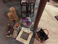 Group view showing most items on floor: tealight holder, jute, firestarter bags, planter, pot, stepping stone