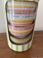 stacked ceramic bowls visible through packaging window