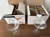 Both boxed sets with two glasses shown out of boxes
