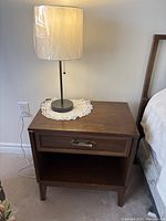 Nightstand with lamp in situ