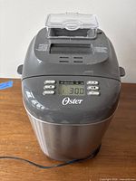 Front view showing control panel, LCD, brand name, exterior condition