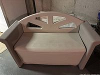 Front view of closed plastic storage bench