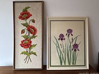 Both framed pieces standing side by side showing relative sizes and frames