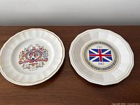 Both commemorative plates side by side
