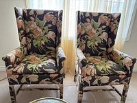 Front view of both high-back floral upholstered chairs