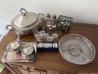 Overview of all silver-plate items on dresser
