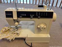 Front view of Singer 6212C sewing machine with sample fabric