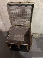 Open trunk showing interior lining and sticker