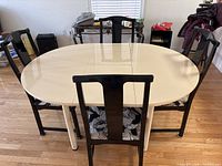 Table with 4 chairs, cream top, black chairs