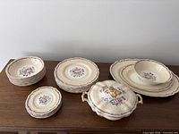 Stacks of dinner, side and soup plates with covered dish