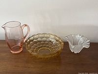 Group shot of pink jug, amber bowl, frosted candy dish