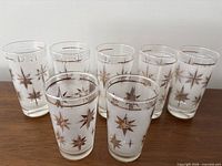 Seven frosted tumblers, two heights visible