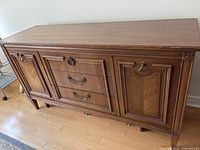 front view showing cupboard doors, drawers, hardware