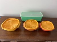 All three Servalier bowls with lids and green celery keeper displayed