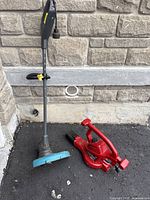 Both tools side by side against wall