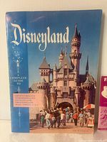Front cover of blue Disneyland Complete Guide booklet