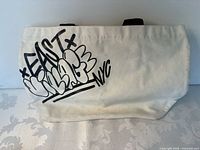 Kiehl's tote side with EAST VILLAGE NYC graffiti graphic