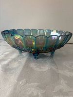 Side view showing scalloped rim and iridescent finish