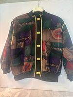 Front view of Vizal Elements patchwork bomber jacket on hanger