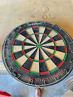 Full view of AMF Grand Champion dartboard showing branding, numbering and wear