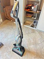 Full view of Bissell CrossWave Premier vacuum upright on stand