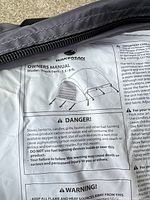 Close-up of Wakeman truck tent owners manual on bag