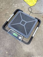 Scale platform with detached display showing zero reading