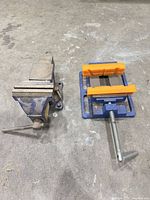 Both vises side by side on floor