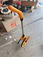 Full view of measuring wheel standing with handle extended