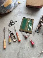 Group of hand tools, compass set, micrometers on floor