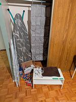 Group shot of drying rack, ironing board, over-door organizer, shoe shelf and smaller accessories