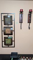 wall art panel with two sconces and candles mounted on wall