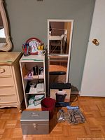 Overall lot showing shelf unit, mirror, clock, shredder, lockbox, waste basket and bag of coin wrappers