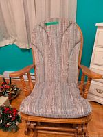 Front view of upholstered glider rocking chair