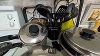 Cookware and utensil holder grouped on countertop