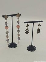 both earring pairs on stands