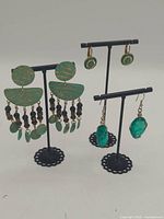 All three earring pairs on stands